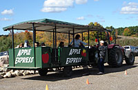 Students board the apple express to tour the orchard and how we grow fruits and vegetables at Lewis Farm Market, Corn Maze & Petting Zoo in New Era, Michigan, north of Grand Rapids. 